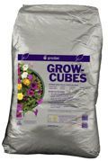 Silver bag of GROW CUBES plant fertilizer with purple label and flowers on the front