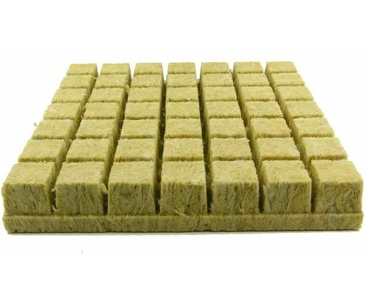 Rows of yellow-green insulation blocks arranged in a grid on a white background