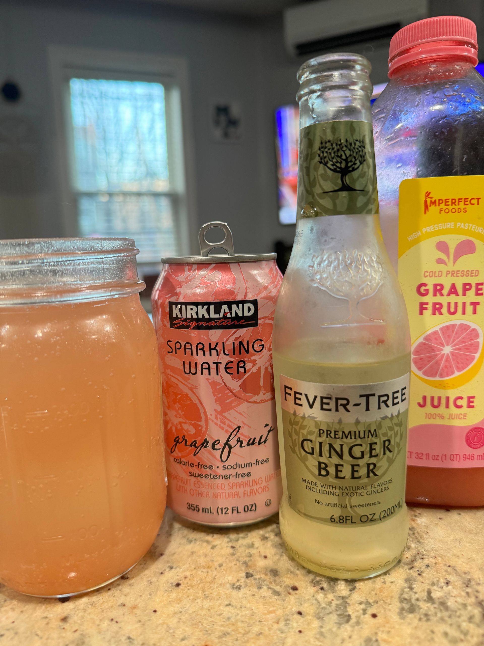 Photo of ingredients; grapefruit seltzet, ginger beer, grapefruit juice