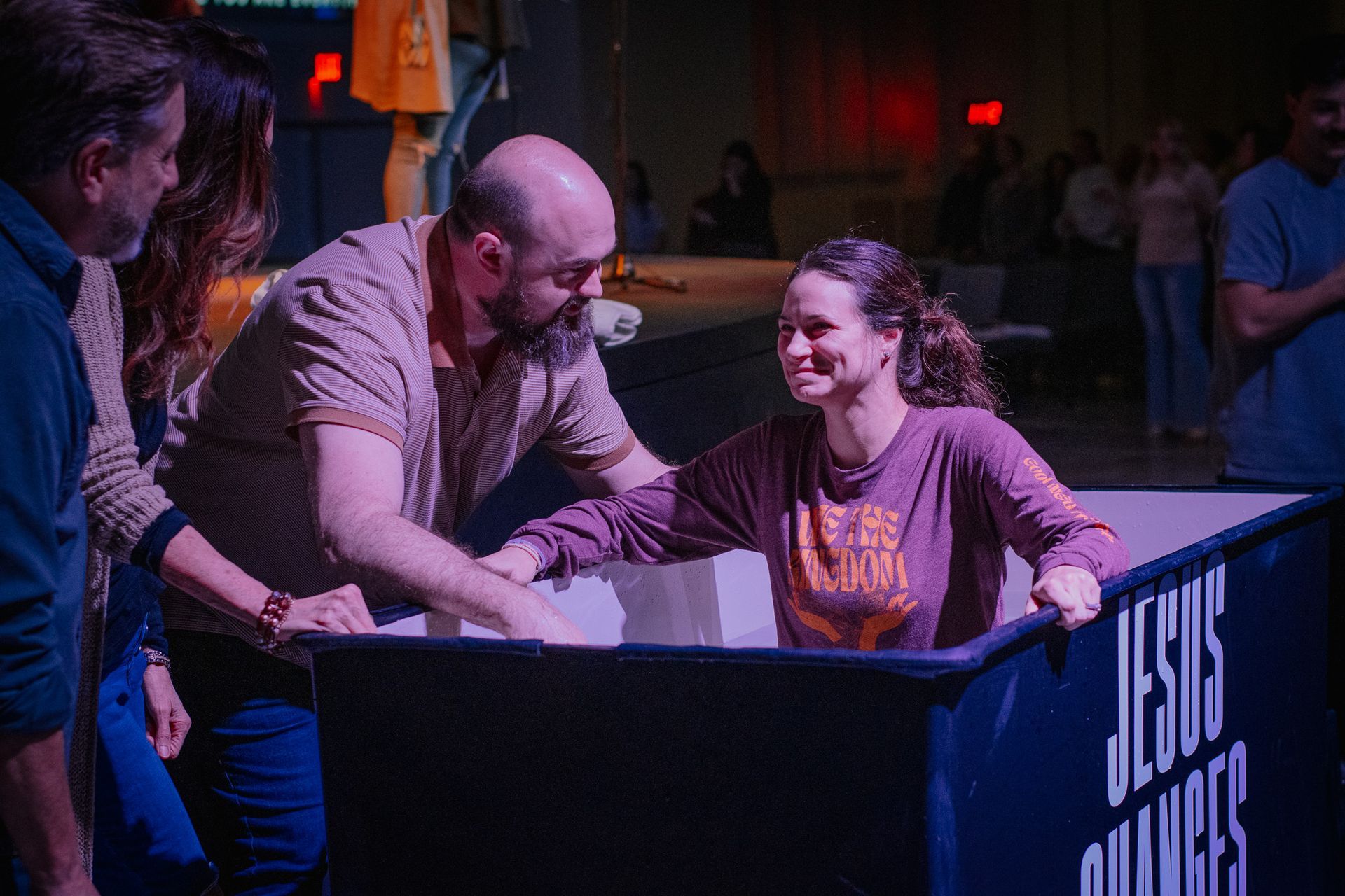 A woman being baptized on a Sunday.