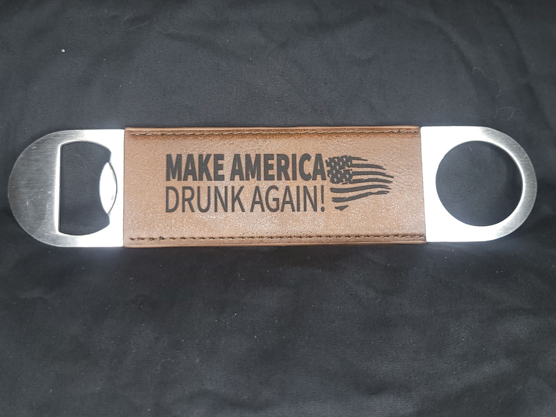 A bottle opener that says make america drunk again