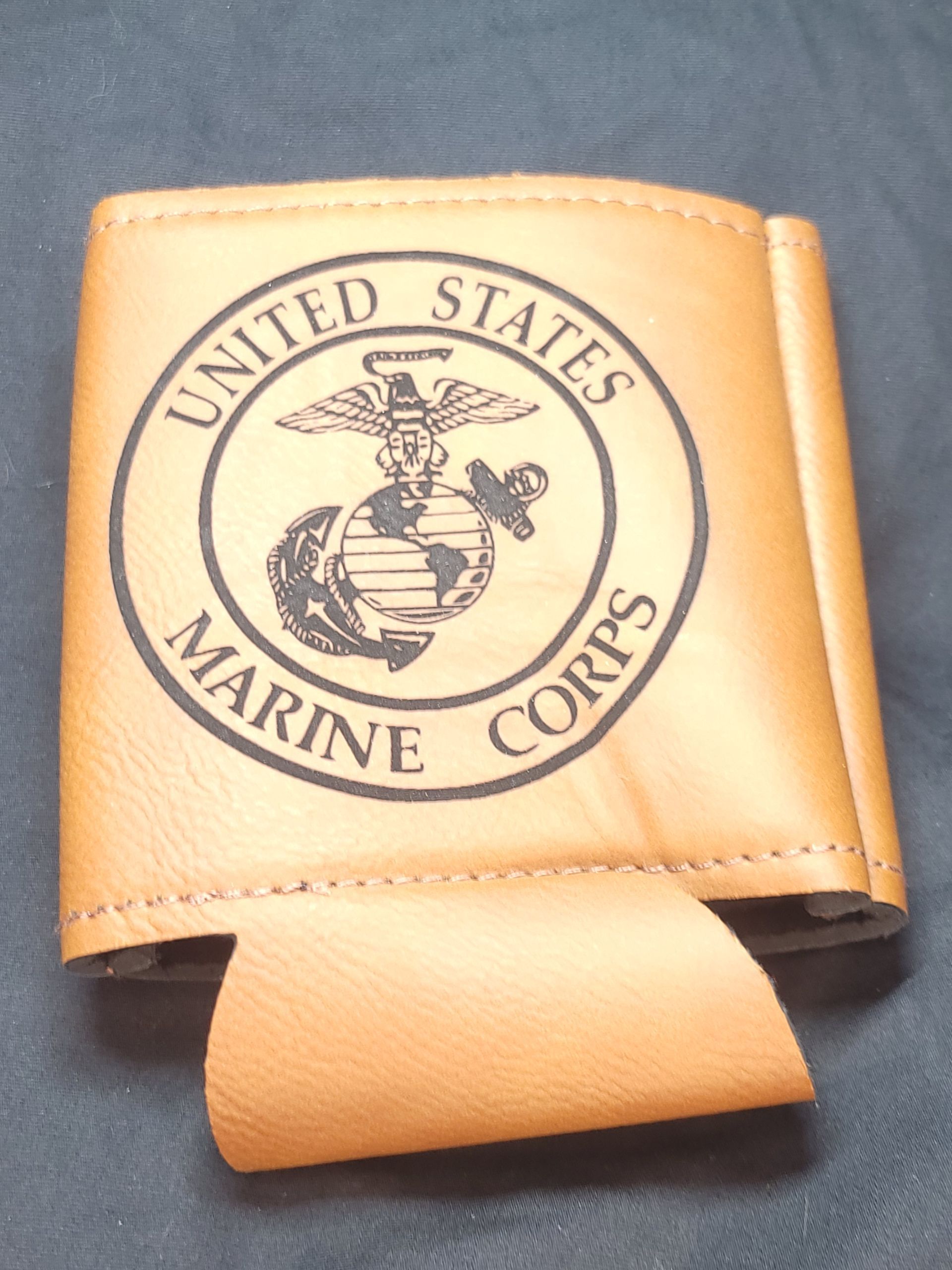A brown leather united states marine corps can holder