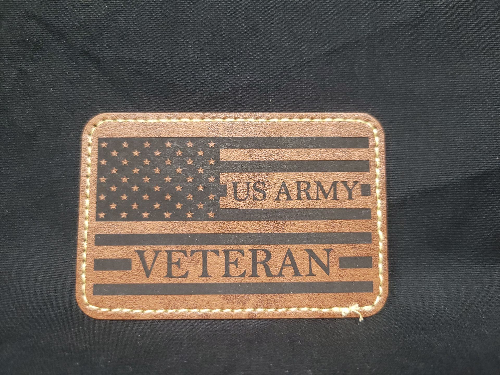 A us army veteran patch with an american flag on it
