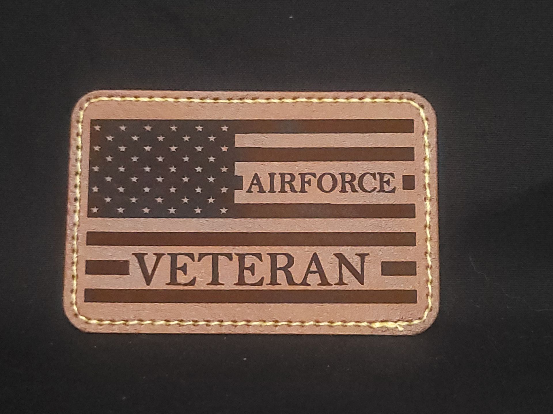A leather patch that says airforce veteran on it