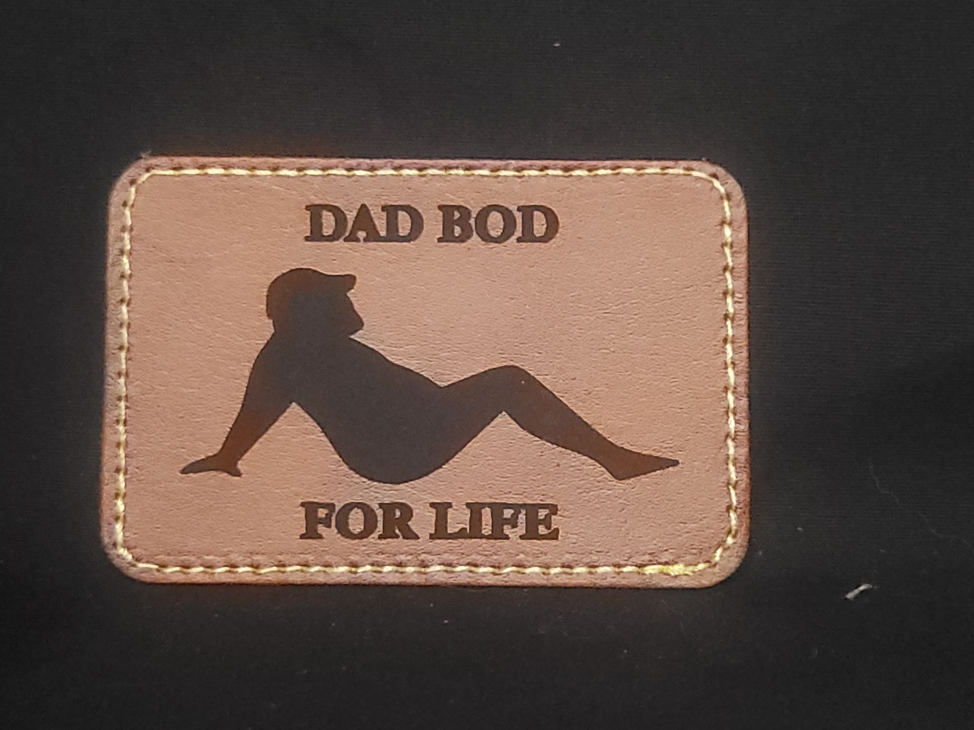 A patch that says dad bod for life on it