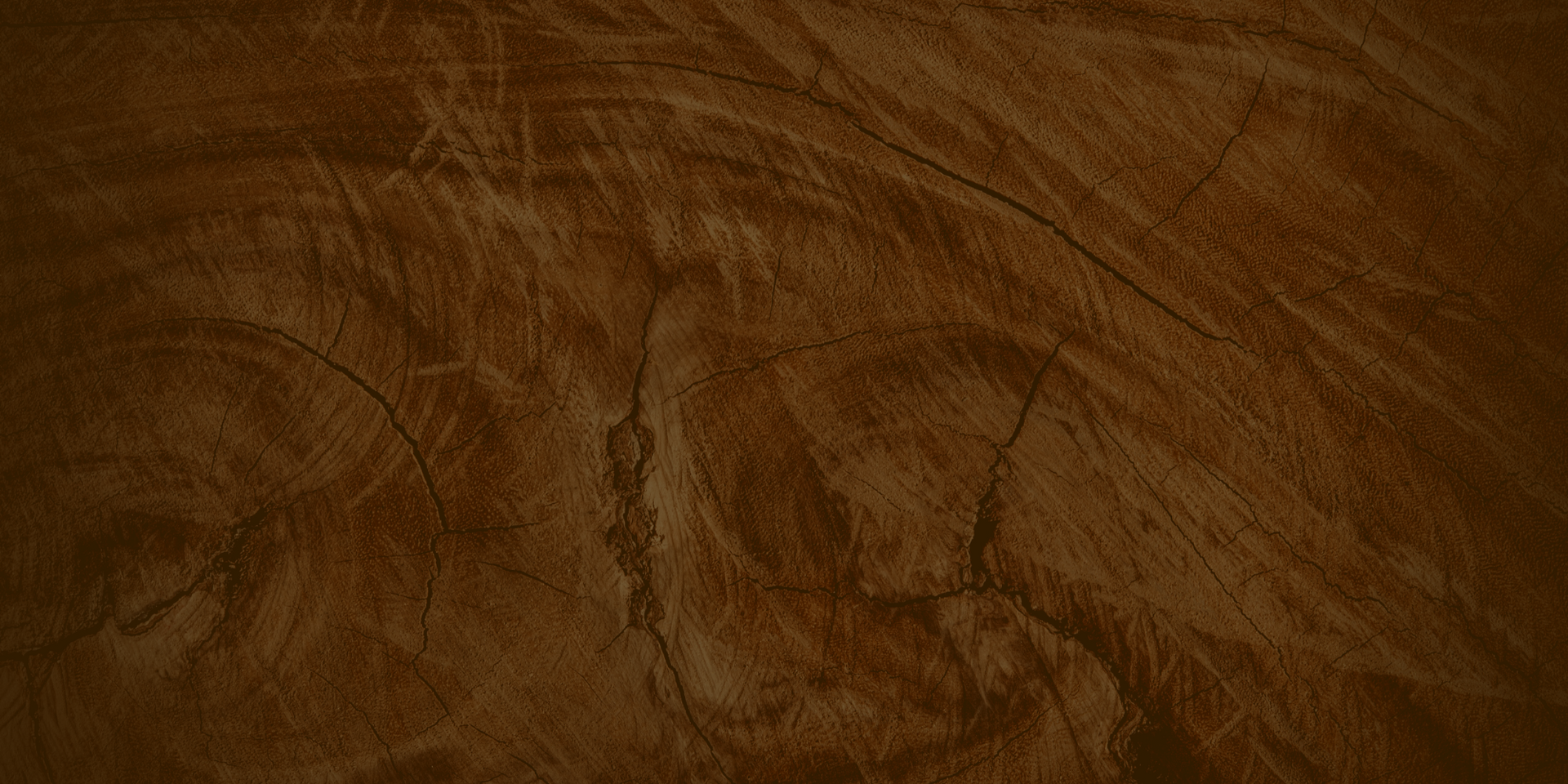Close-up of wrinkled brown leather texture with a seam running vertically