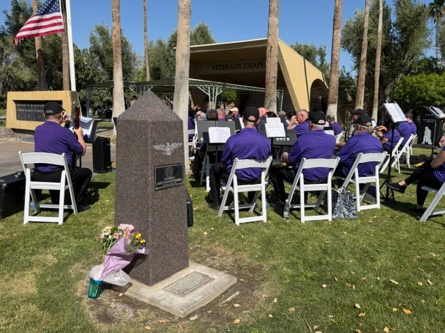 The pep band performs on Memorial day next to the LGBTQ veterans memorial