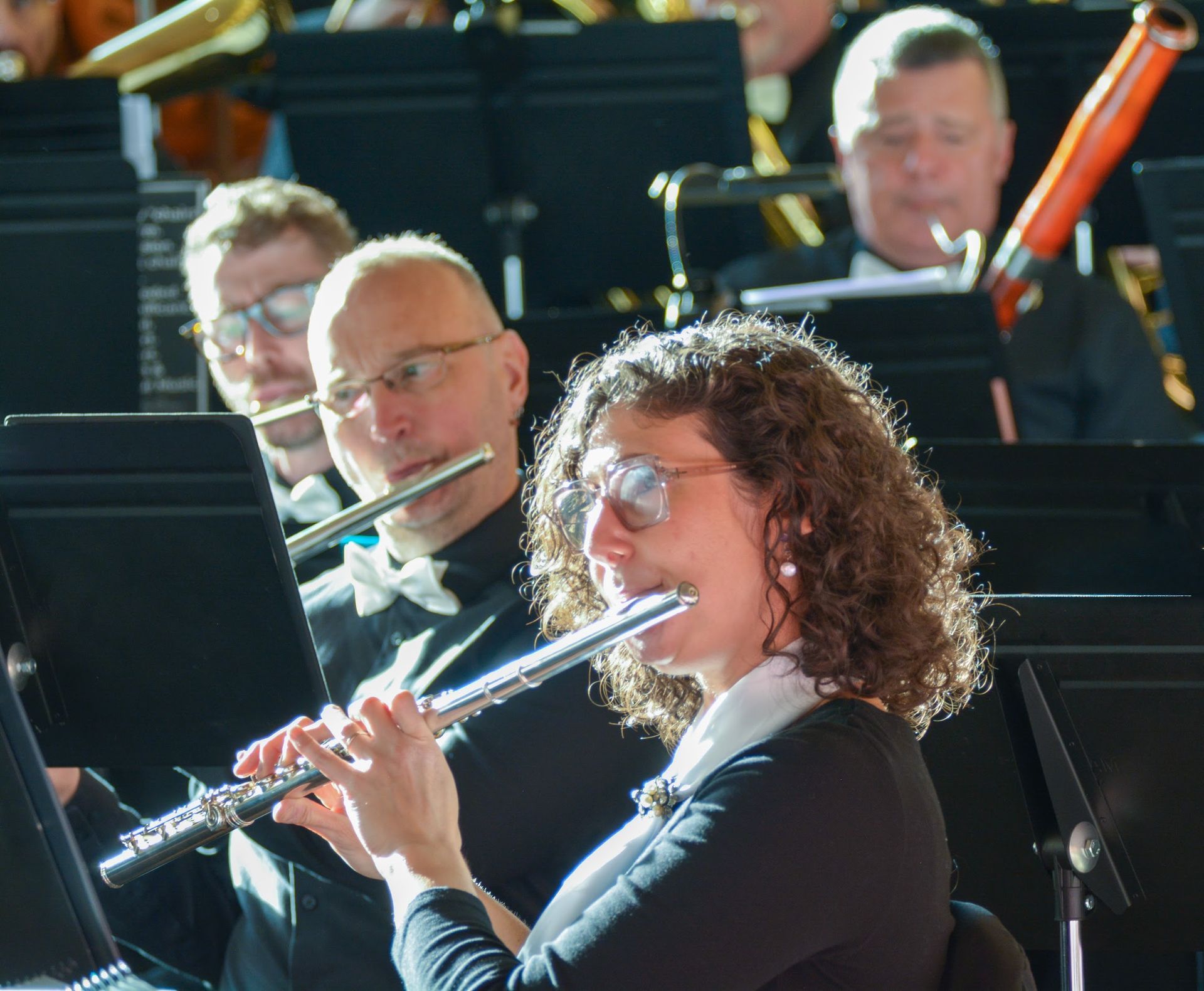 Flute section at the spring concert bathed in light from the large windows in Temple Isaiah.