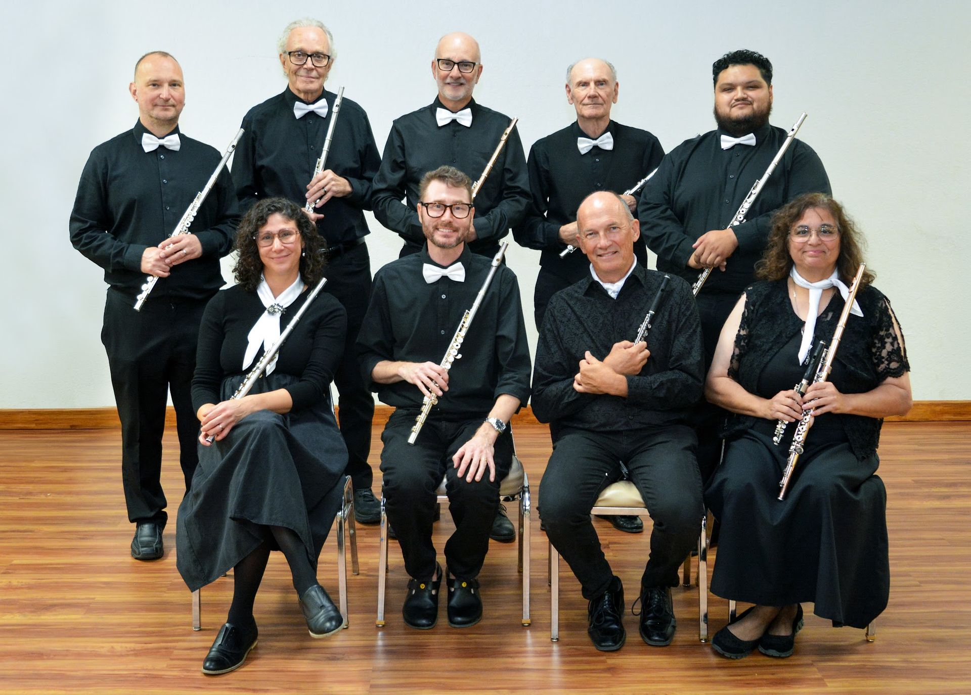 Photo of our flute and piccolo section at last years spring concert. The section contains 9 performers.