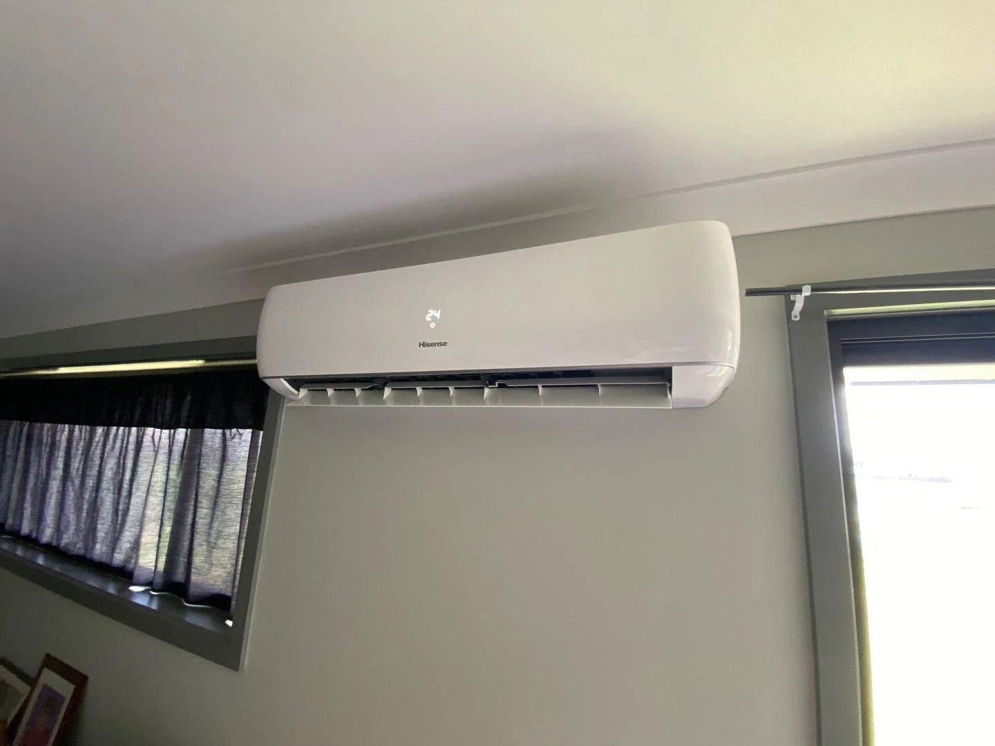 A White Wall Mounted Air Conditioner Unit Is Installed Indoors — JF Air Conditioning Pty Ltd in Lake Macquarie, NSW