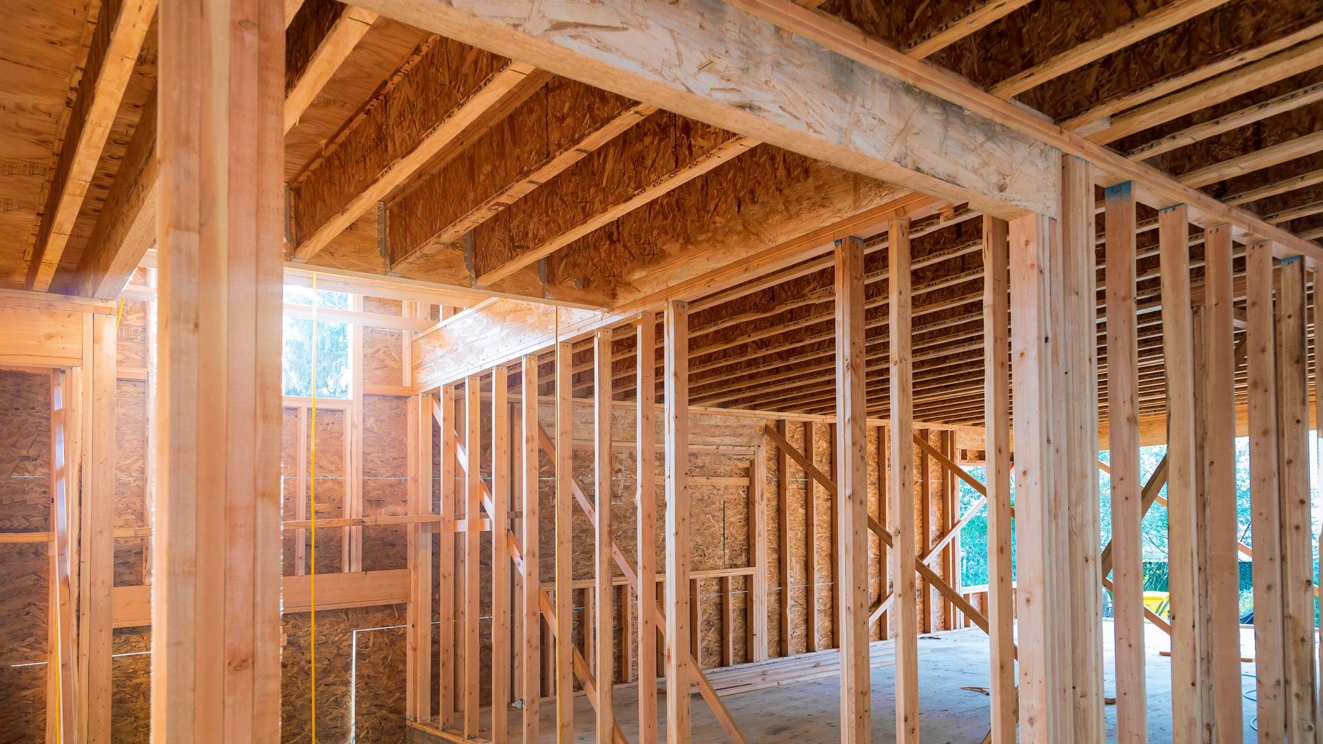 A house is being built with wooden beams.
