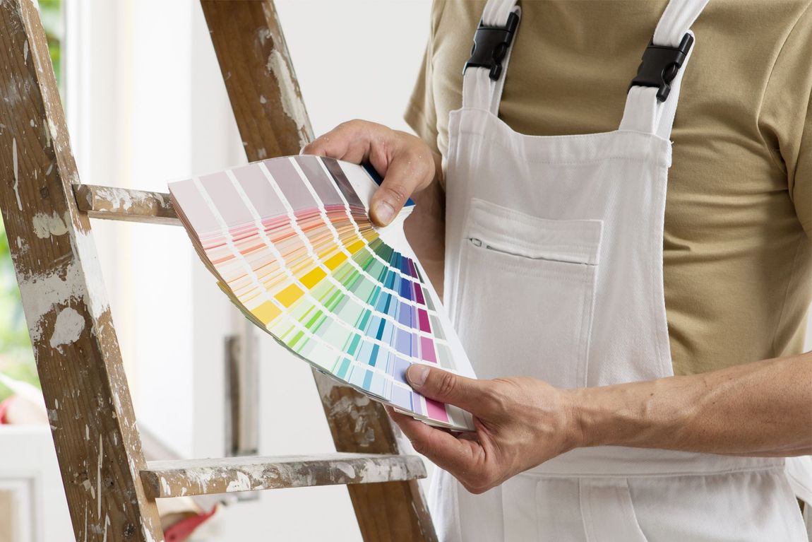 Painter Looking at the Color Palette