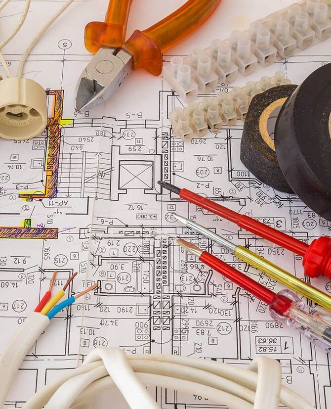 A bunch of tools laying on top of a blueprint