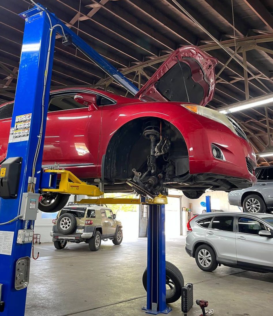Toyota Venza on lift for wheel bearing repair