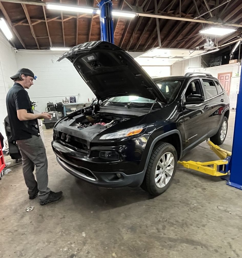 Technician working on a Jeep Cherokee at PROFIX West