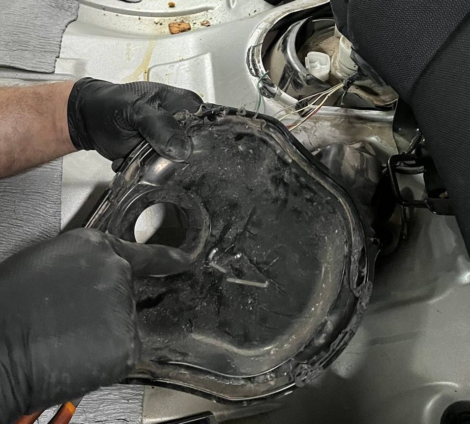Fuel pump access cover on Toyota Corolla