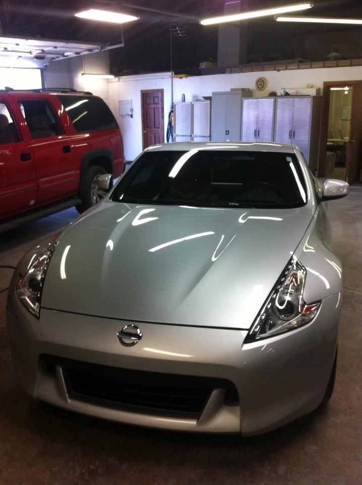 Silver Nissan Parked Inside Auto Shop | PROFIX Auto Repair and Leon's PROFIX Auto Repair