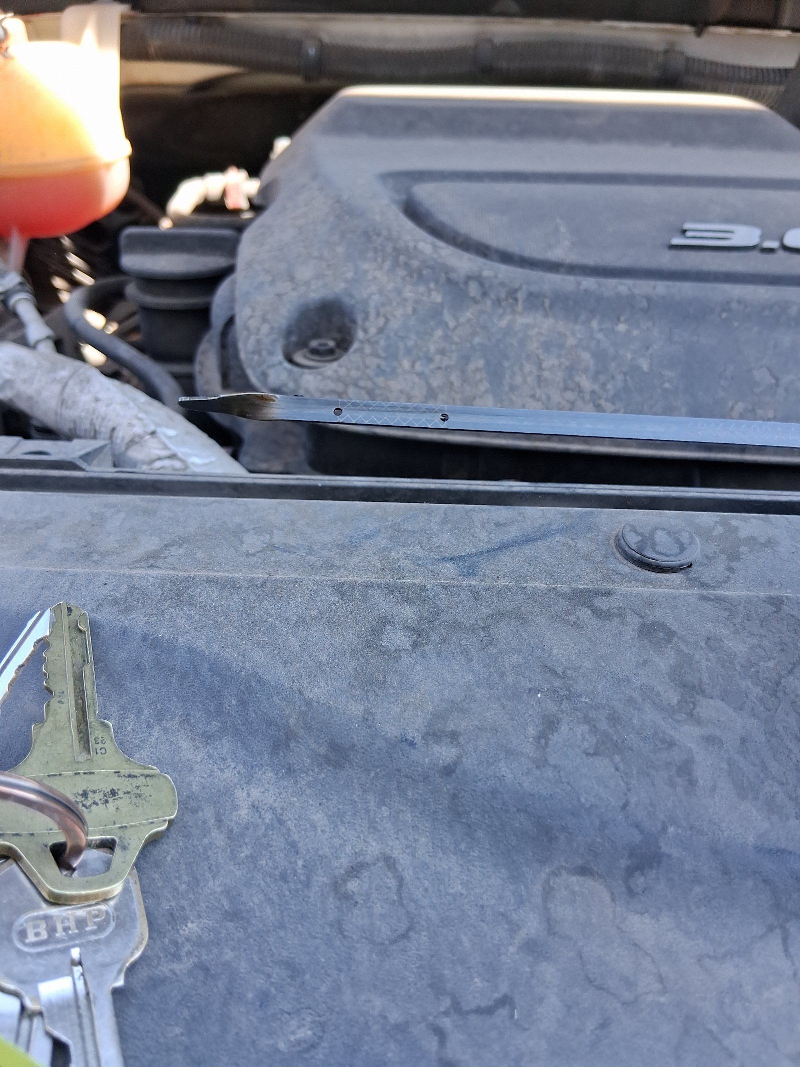 The engine oil level was extremely low, with essentially no oil registering on the dipstick.