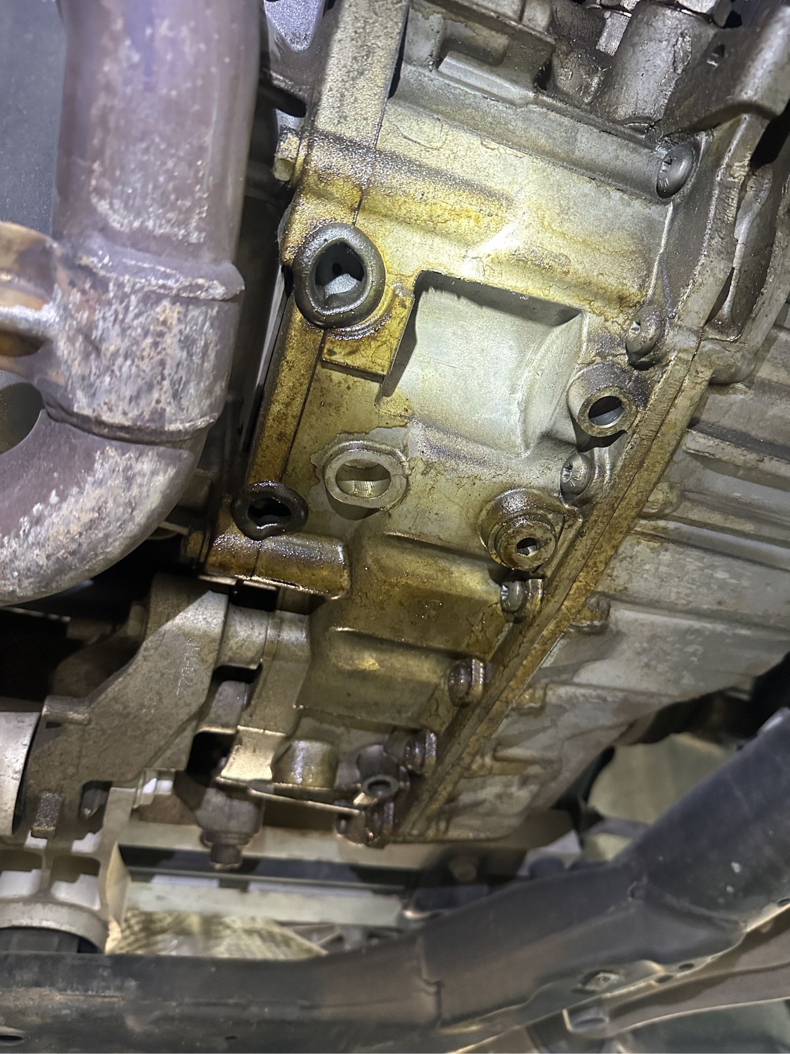 Oil residue was visible underneath the engine. The area will be cleaned and reinspected so the source of the leak can be identified accurately.