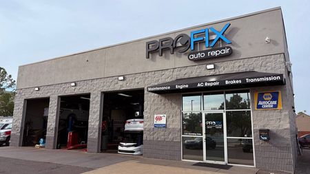 Customer Waiting Area With Chair, Water Dispenser, And Wall Art | PROFIX Auto Repair and Leon's PROFIX Auto Repair