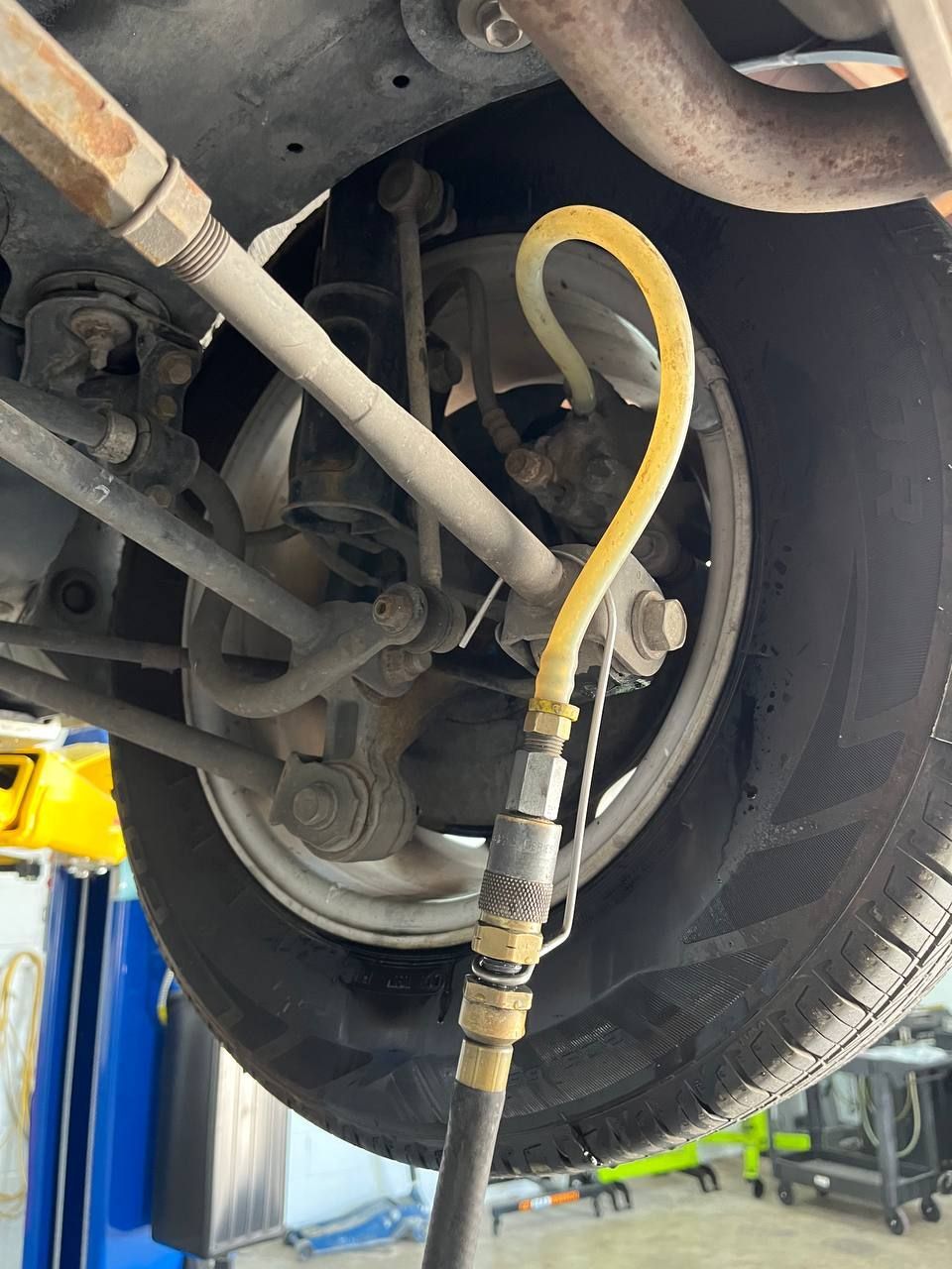 Fresh brake fluid is moved through the braking system to remove old, moisture-contaminated fluid from the hydraulic lines and components.