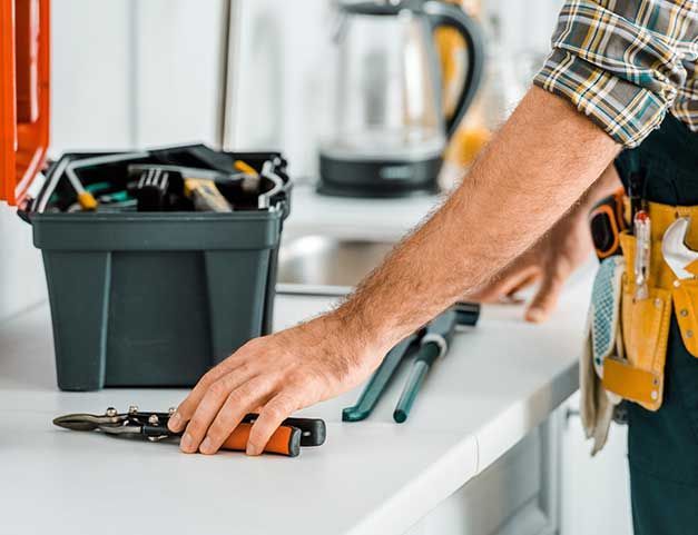 lumber putting tools on kitchen counter in kitchen
