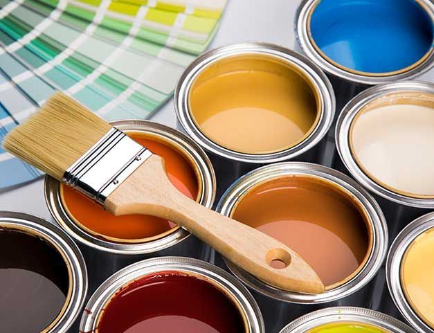Colorful paint cans with paintbrush