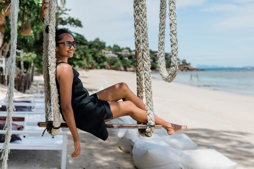 Relaxing on a swing while on vacation from my writing job.