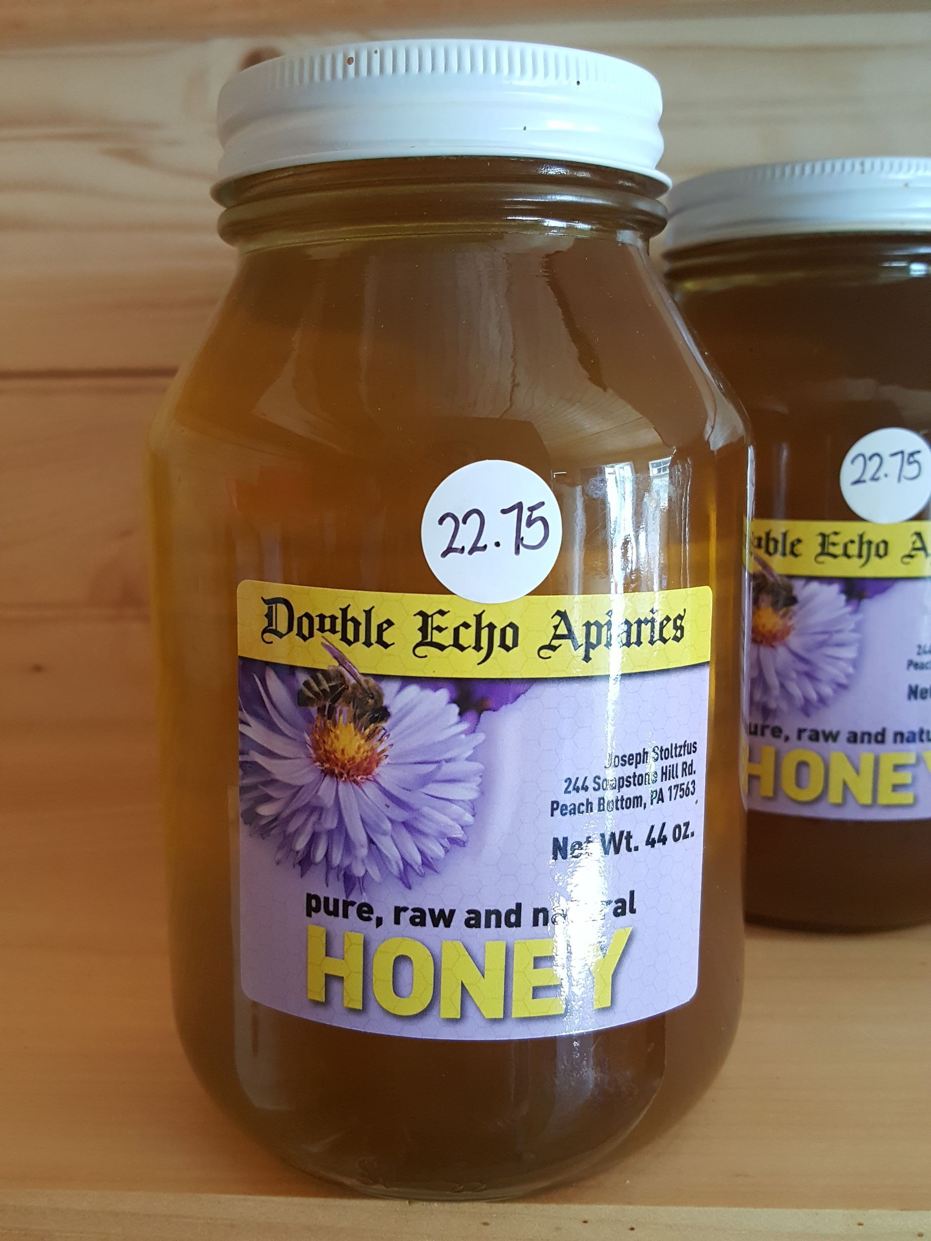 Two jars of honey from double echo apiaries