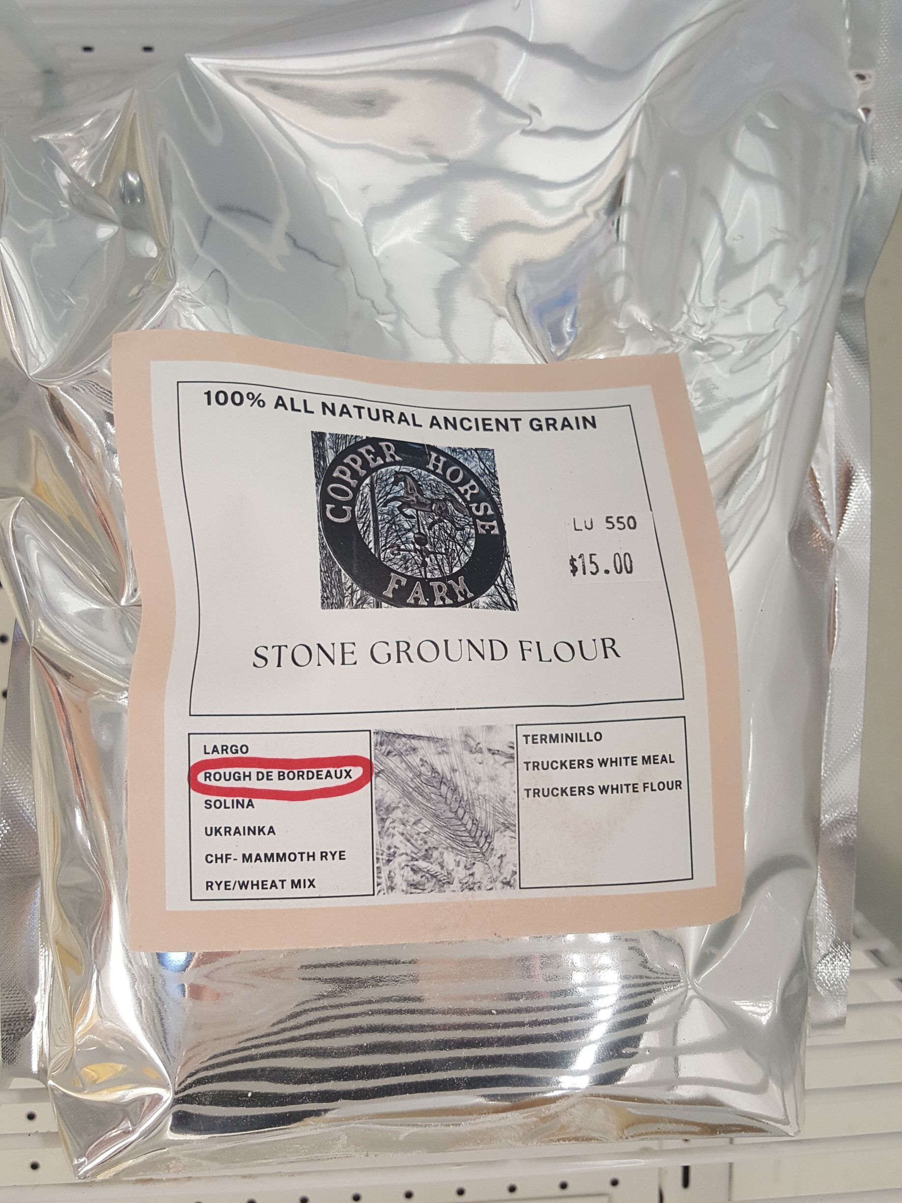 A bag of stone ground flour is sitting on a table