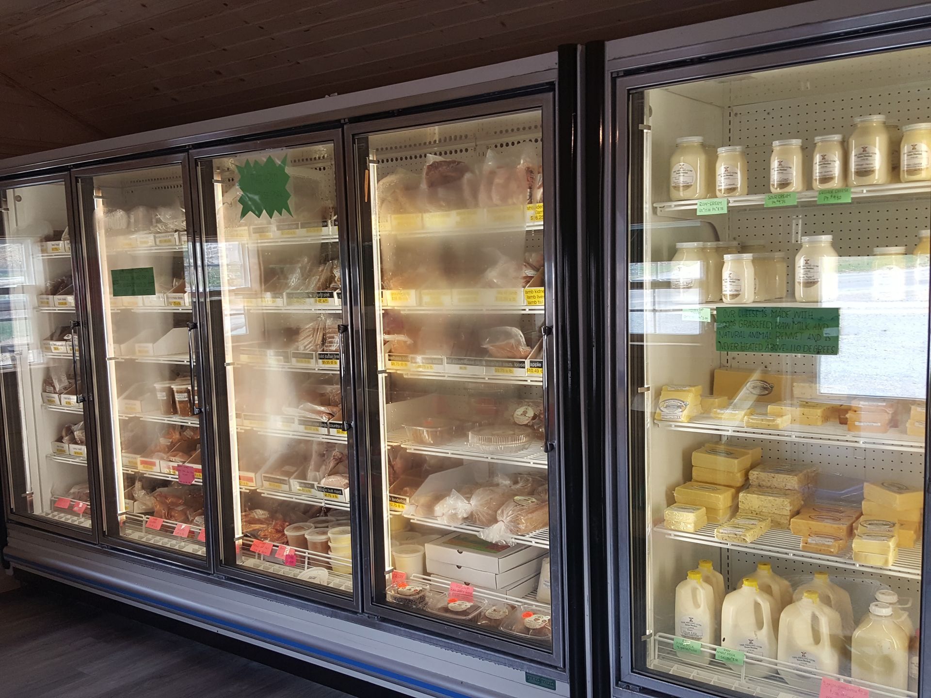 A grocery store refrigerator filled with lots of food