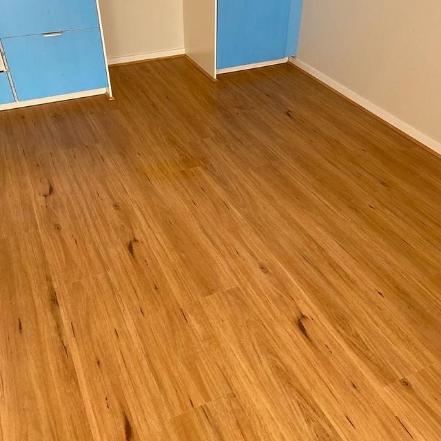 Wood Floor and Blue Cabinet — Chadstone, Vic — Eliza Flooring Wood Floor and Blue Cabinet — Chadstone, Vic — Eliza Flooring