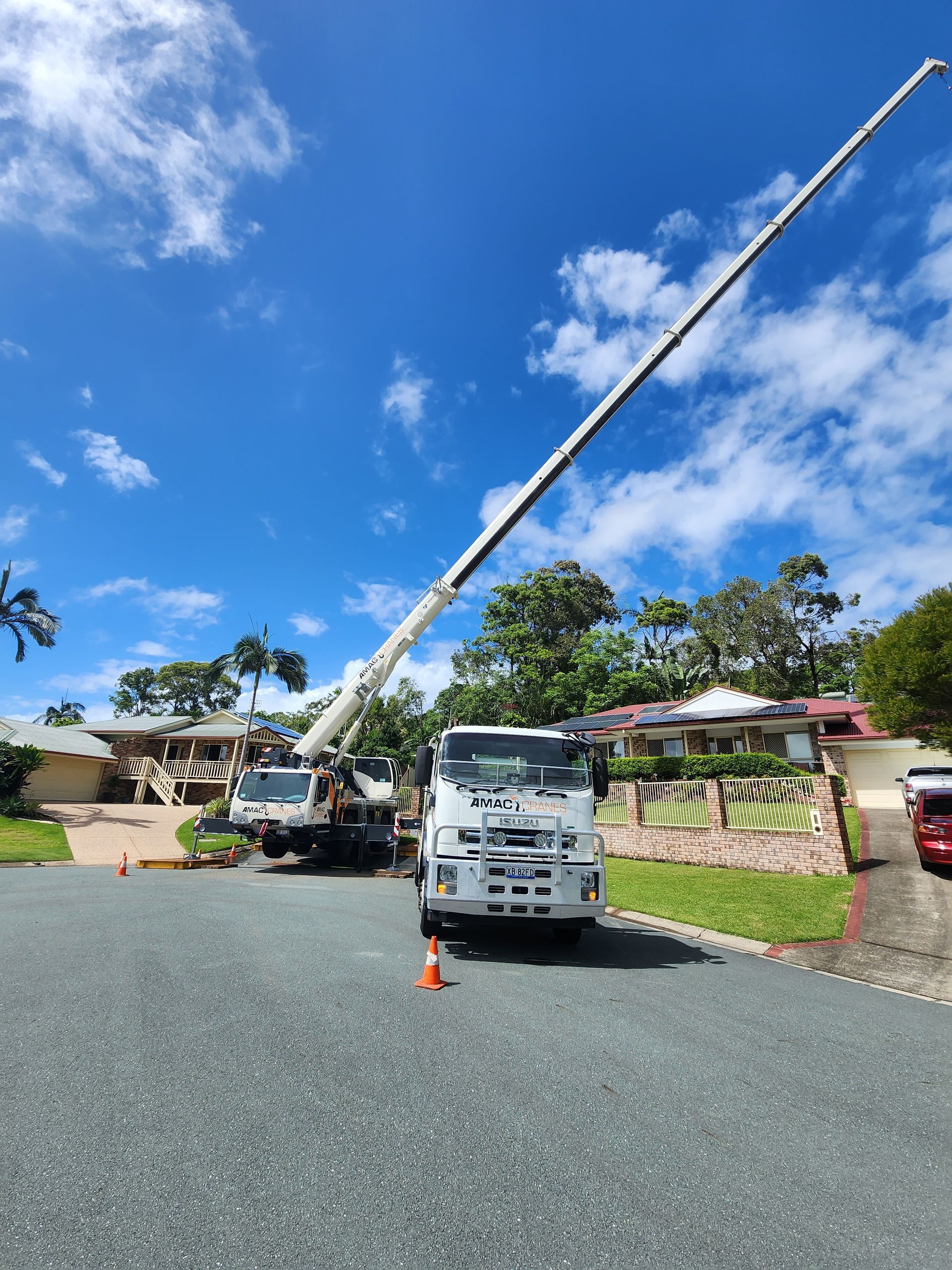 A Large Crane Is Attached to The Back of A Semi Truck — AMAC Cranes in Caloundra, QLD