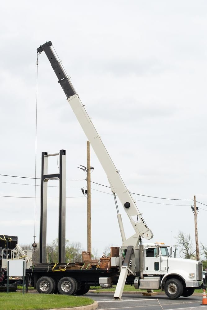 A Large Crane Is Attached to The Back of A Semi Truck — AMAC Cranes in Coolum Beach, QLD
