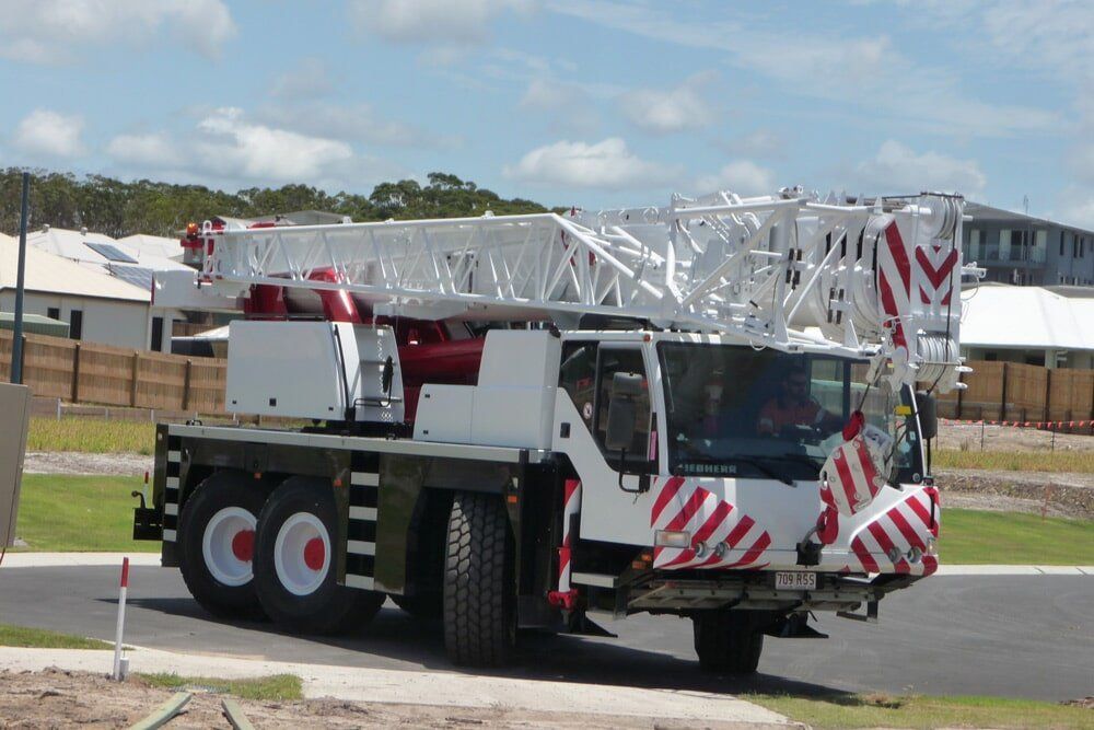 A White Truck with The Word Coe on The Back — AMAC Cranes in North Lakes, QLD