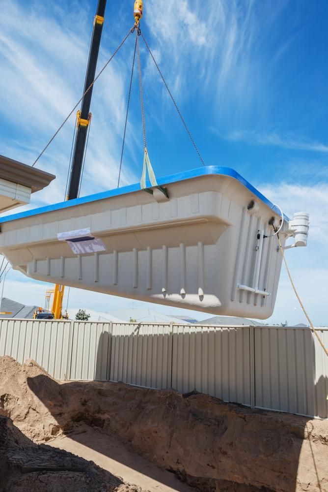 A Large Swimming Pool Is Being Lifted by A Crane — AMAC Cranes in Coolum Beach, QLD