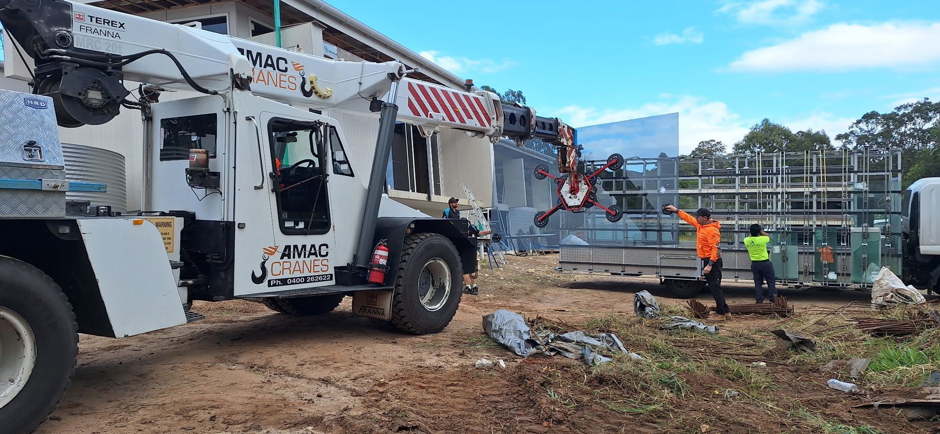 A White Crane At A Construction Site — AMAC Cranes in Coolum Beach, QLD