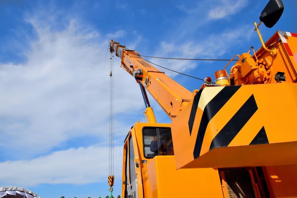 Yellow Crane with A Blue Sky in The Background — AMAC Cranes in Coolum Beach, QLD Yellow Crane with A Blue Sky in The Background — AMAC Cranes in Coolum Beach, QLD
