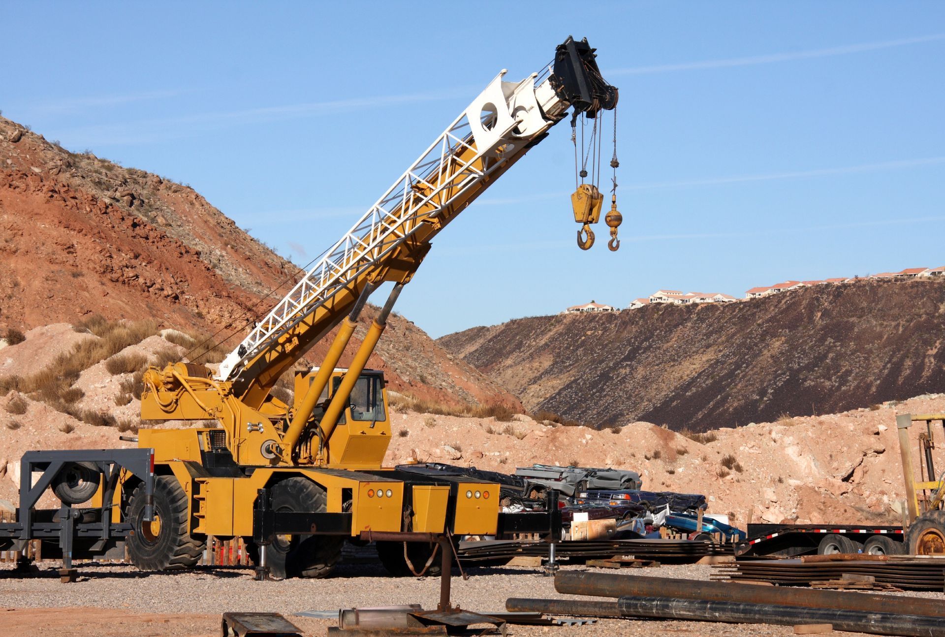 Large Yellow Crane Is Sitting in The Middle of A Desert — AMAC Cranes in Coolum Beach, QLD Large Yellow Crane Is Sitting in The Middle of A Desert — AMAC Cranes in Coolum Beach, QLD