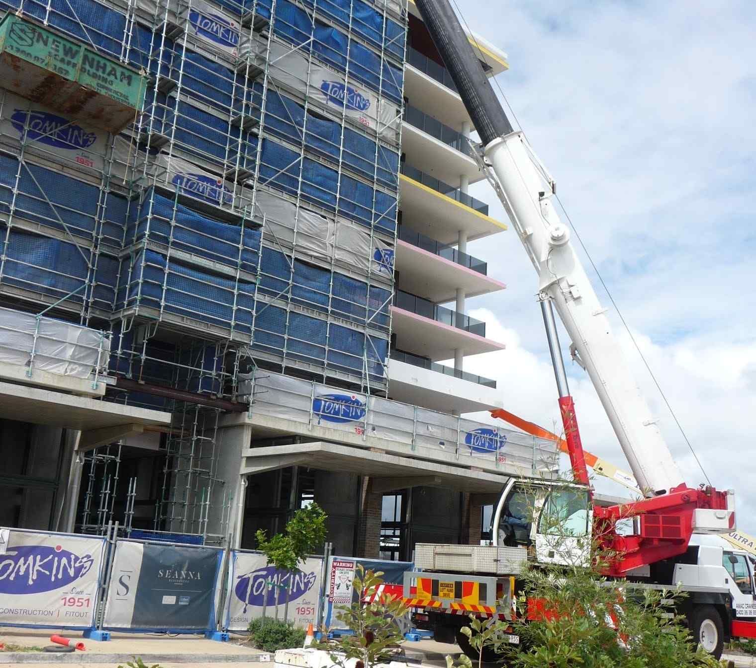 Crane Services Lifting Equipment At A Multi-Storey Construction Site.