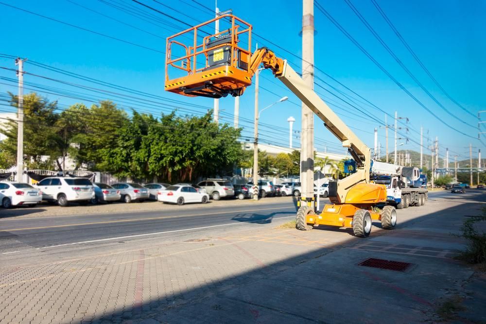 A Crane Is Sitting on Top of A Pole in A Parking Lot — AMAC Cranes in Coolum Beach, QLD