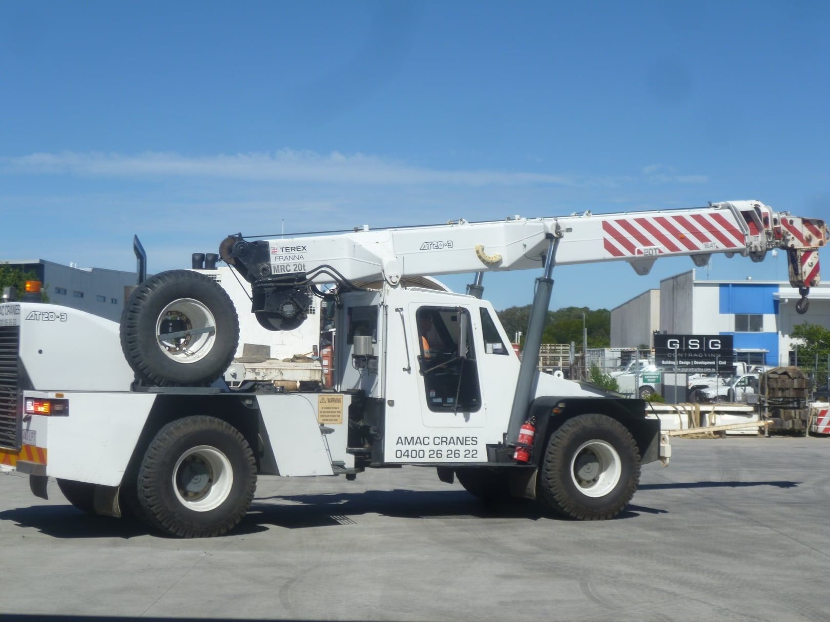 White AMAC Crane Truck on an Industrial Site