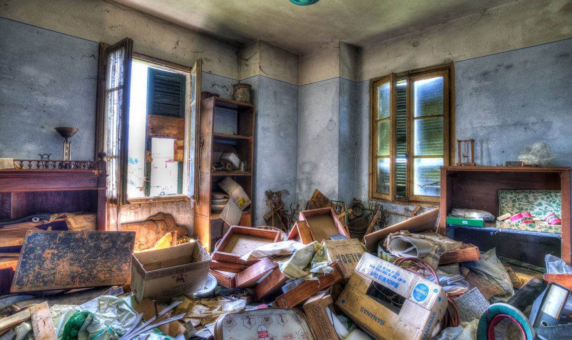 Messy kitchen with dishes piled up