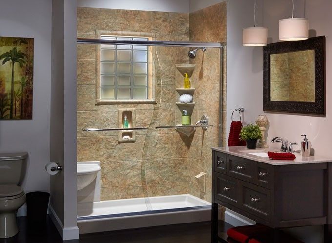 A bathroom with a sliding glass shower door