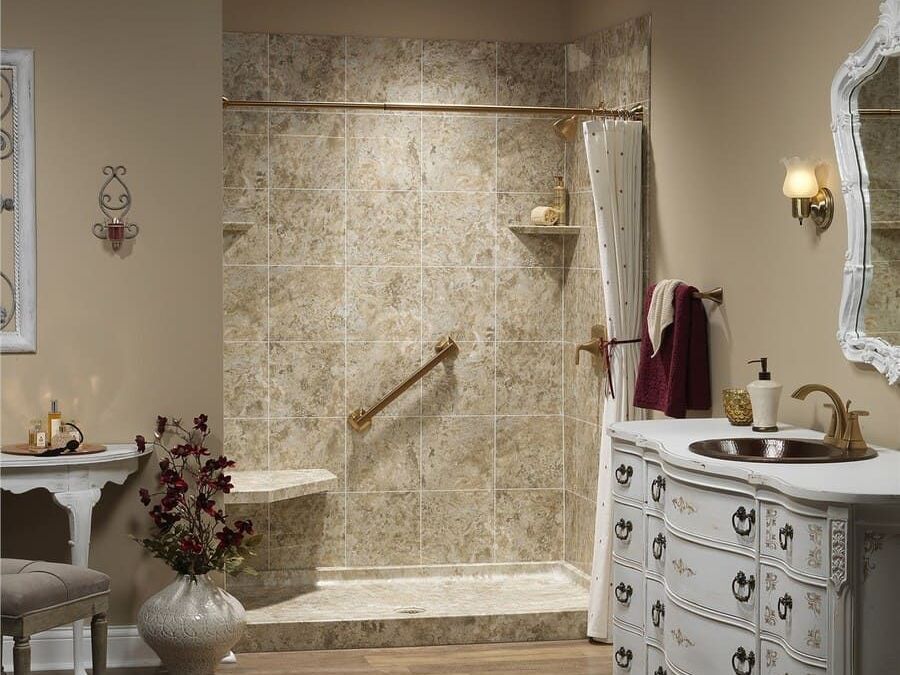 A bathroom with a walk in shower and a sink