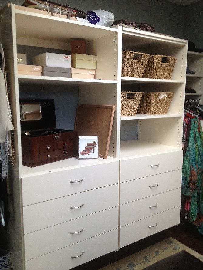 White storage shelves with baskets, boxes, and a printer above multiple drawers in a home office.