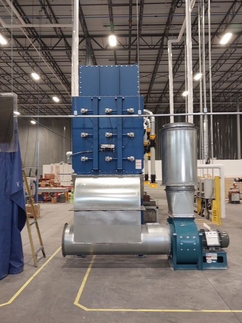 Blue industrial dust collection system in a factory.