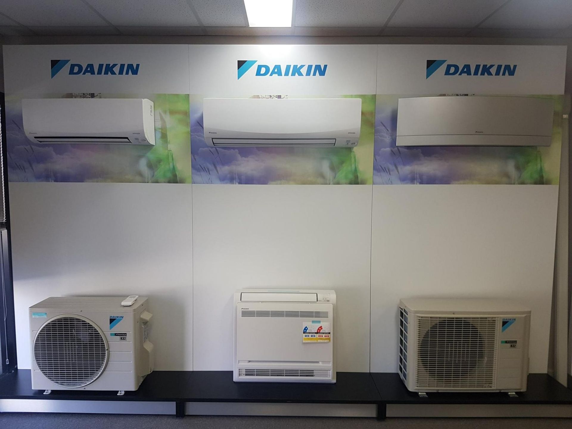 Three Daikin Air Conditioners Are Displayed On A Wall — Jervis Bay Airconditioning In Kemblawarra, NSW