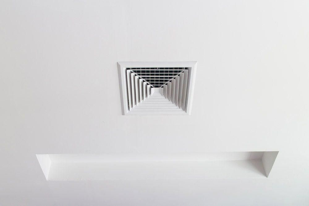 A Square Air Vent Is Installed In The Ceiling Of A Room — Jervis Bay Airconditioning In Albion Park, NSW