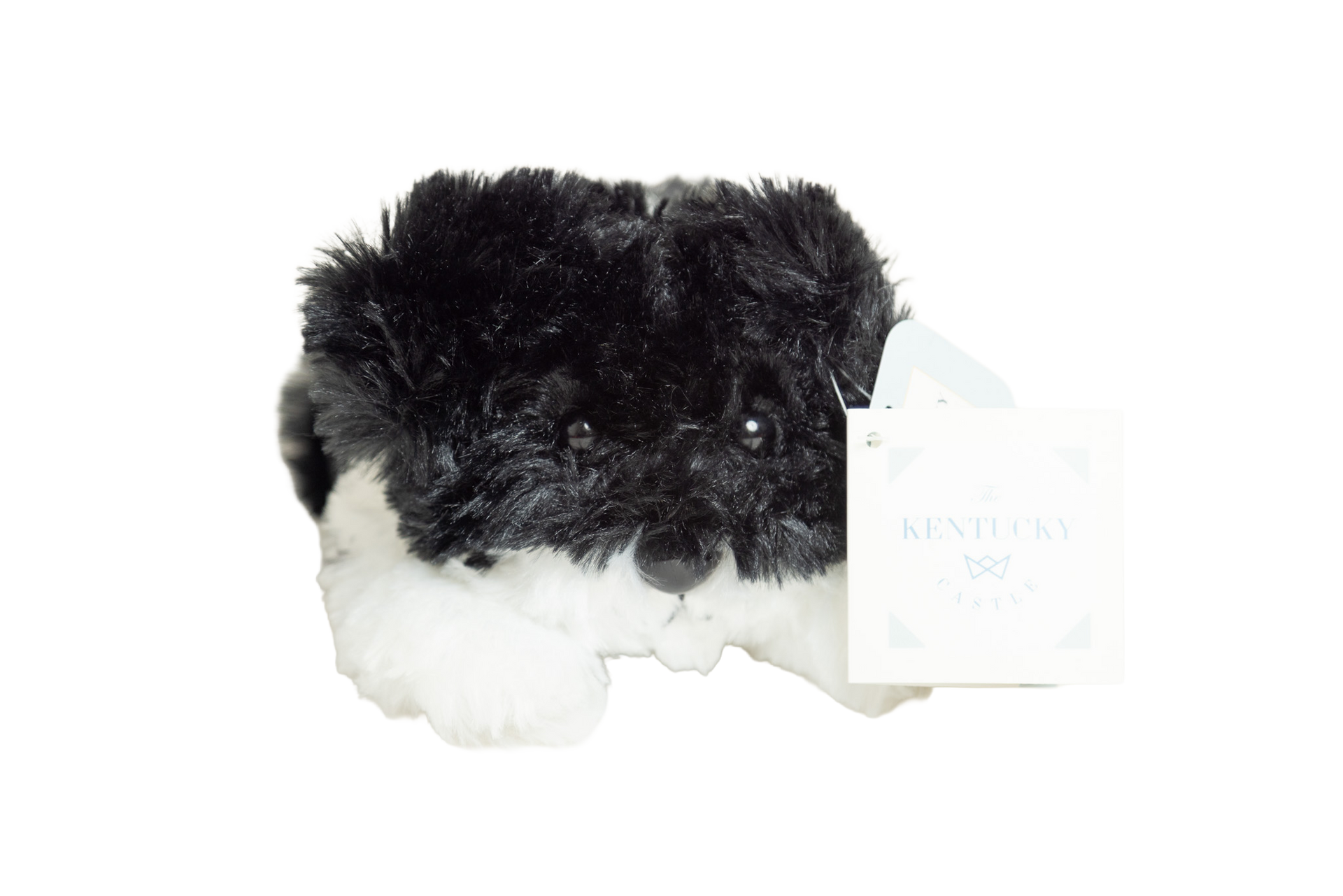 a plush toy of a dog with black and white fur
